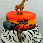 Bespoke Designer Celebration Cakes jungle theme cake carrot cake chocolate cake modeling chocolate animals giraffe, elephant, chimpanzee hand painted jungle zebra pattern
