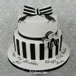 Black and White chocolate cake for 50th and 60 Birthday two tier cake, brush embroidery royal icing, gum paste bows