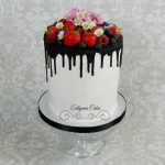 Bespoke Designer Celebration Cakes Vegan, dairy and egg free double barrel 6inch cake with dairy free chocolate drip fresh berries, daisies and cherry blossoms