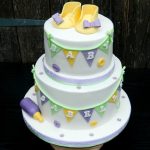 Baby shower cake in pastel colours baby shoes booties