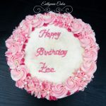 Butter cream cake with pink piped flowers