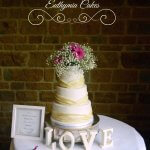 Luxury Wedding Cakes Eva Cockrell Cake Design Dodford Manor wedding cake with ivory pleats and fresh flowers Milton Keynes