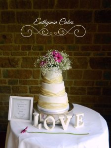 Newton Park Farm Barn Wedding showcase 29th April 2018 Dodford Manor wedding cake with ivory pleats and fresh flowers Milton Keynes