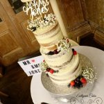 semi naked wedding cake with gypsophilla and fresh berries Fawsley Hall