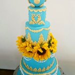 Luxury Wedding Cakes Eva Cockrell Cake Design Blue and gold wedding cake with sunflowers