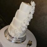 Luxury Wedding Cakes Eva Cockrell Cake Design Star Wars reveal wedding cake with sugar flowers