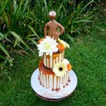 Caramel drip 1st birthday cake with edible Morph cake topper