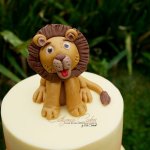 Safari theme 1st birthday cake with edible lion topper