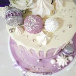 Purple and silver marble butter cream cake with white chocolate drip and fresh flowers