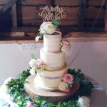 Luxury Wedding Cakes Eva Cockrell Cake Design Semi naked wedding cake with fresh flowers in Newton Park Barn Blossomville