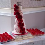 Luxury Wedding Cakes Eva Cockrell Cake Design Red and white piped designer wedding cake and cupcakes with fresh roses Shendish Manor