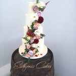 Luxury Wedding Cakes Eva Cockrell Cake Design Textured butter cream cake with fresh flower cascade
