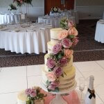 Luxury Wedding Cakes Eva Cockrell Cake Design Semi naked wedding cake with pink and purple roses in Shendish Manor