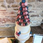 Luxury Wedding Cakes Eva Cockrell Cake Design Round and Heart shaped French macarons on two tier semi naked wedding cake in Dodford Manor Northampton