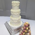 Luxury Wedding Cakes Eva Cockrell Cake Design lambeth method inspired wedding cake in white and green with macaron tower by Eva Cockrell Cake Design