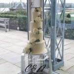 4 tier textured butter cream wedding cake with fresh flowers in Ely