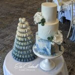 Marbled navy blue wedding cake with Ombre blue French macaron tower