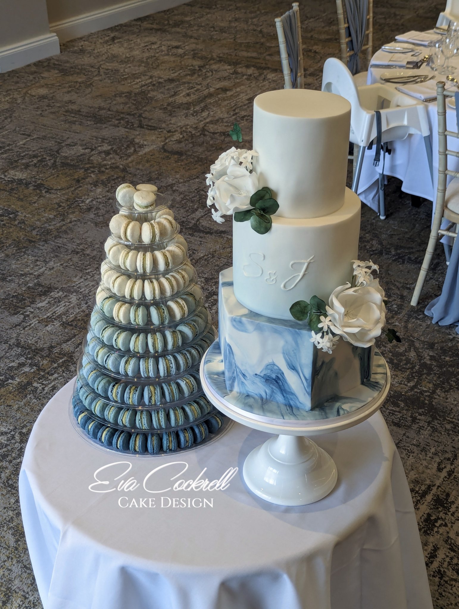 Marbled navy blue wedding cake with Ombre blue French macaron tower at the Horwood House Hotel