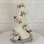 Textured butter cream cake with fresh florals supplied by Clare Jones Floral Design
