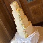 4 tier white wedding cake with white edible flowers by Eva Cockrell Cake Design