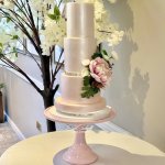 Pink ombre simple shimmer wedding cake with acrylic plates at the Horwood House Hotel